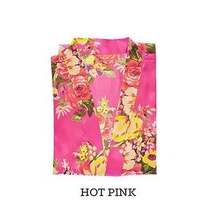 Three hot pink David’s Bridal bridesmaids robes!